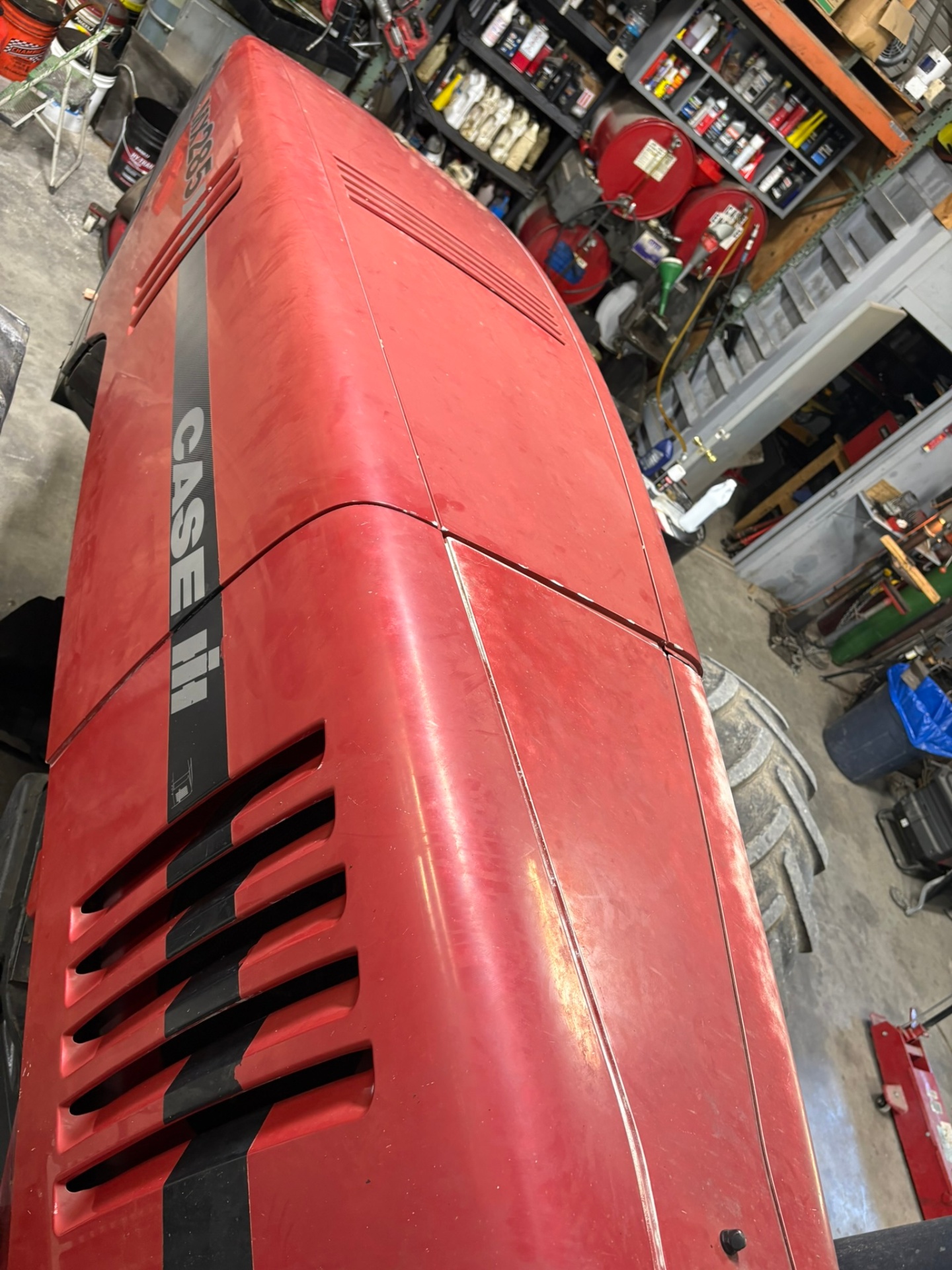 Faded oxidized Case IH tractor before polishing